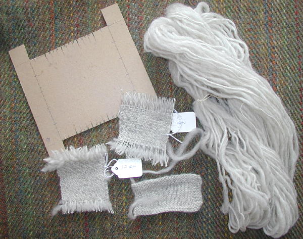 Sample 'loom', woven and knit samples, and unsized skein